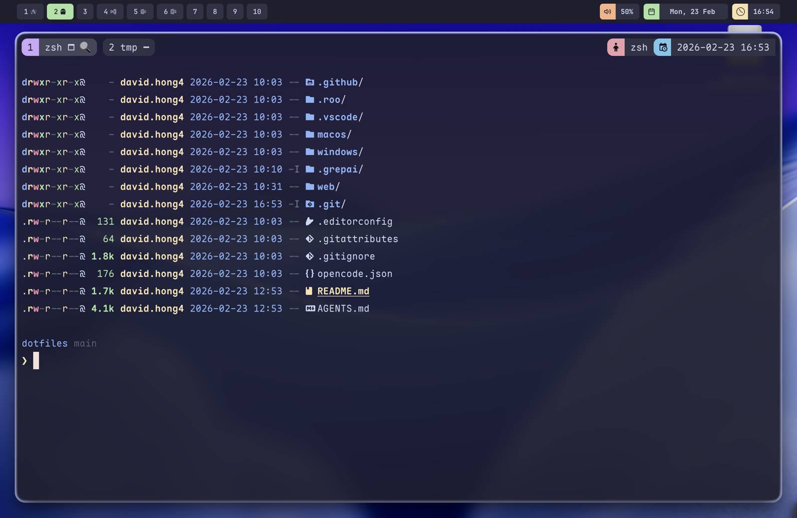 macOS terminal running tmux and zsh, listing the dotfiles repository — folders for macos, windows and web alongside README.md, AGENTS.md and dotfiles like .editorconfig — in a purple colour scheme with a “dotfiles main” status bar.
